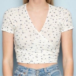 Brandy Melville tie up top. White with blue flowers